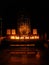 Numerous candles enlight the solemn catholic chapel`s altar