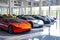 Numerous cars parked in an enclosed building, forming a diverse and impressive collection of vehicles, A group of modern electric