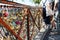 Numerous padlocks and combination locks fixed to a fence in Paris