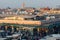 Numerous satellite communication dishes on rooftops