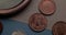 Numismatics. Old collectible coins and a magnifying glass on the table