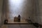 A nun at an alter inside the Notre Dame du Haut chapel in Ronchamp, France