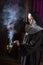 Nun preparing incense for mass