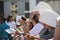 Nuns and Catholic faithful are praying during Corpus Christ mass