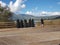 Nuns sisters in black greek orthodox religion  in sunny day looking at a lake