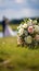 Nuptial scene Wedding bouquet rests on grass with married couple