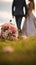 Nuptial scene Wedding bouquet rests on grass with married couple