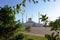 NUR-SULTAN, ASTANA, KAZAKHSTAN - JUNE 3, 2015: White Nur Astana mosque with golden dome from special angle of view from green