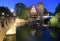 Nuremberg cityscape at night. View on MaxbrÃ¼cke bridge, Weinstadel and Wasserturm in old city Nuremberg, Germany