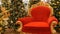 Nuremberg, Germany - December 3, 2018: Red chair of Santa Claus or St. Nicholas near christmas tree at the mall