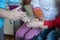 A nurse administers an intravenous medicine to a child