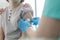 Nurse applying bandage on boy arm at hospital