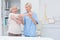 Nurse assisting senior patient in raising arm