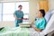 Nurse Bringing Breakfast For Patient In Hospital