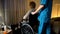 Nurse bringing depressed old wheelchair woman to window nursing home loneliness