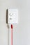 Nurse call switch with emergency pull cord on white wal