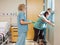 Nurse Carrying Hospital Gown For Pregnant Woman