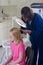 Nurse checking for head lice