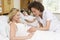 Nurse checking pregnant woman\'s belly and smiling