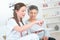 Nurse discussing medication with elderly woman