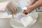 Nurse disinfects a patients hand at a sink