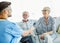 nurse doctor senior care caregiver help assistence retirement home hospital nursing man handshake insurance