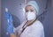 nurse doctor wearing Santa hat prepares the syringe for injection