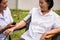 Nurse doing pressure measuring for female patient at the hospital park