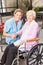 Nurse and elderly woman in a wheelchair