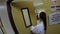 Nurse enter room carrying infant to his mother in hospital room