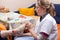 Nurse examine foot of an patient