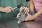 Nurse Examining Rabbit With Otoscope On Table