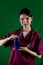 nurse girl holding a medicine bottle in her hands  on a monochrome studio background.