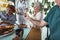 Nurse giving medicine to seniors at nursing home