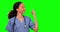 Nurse, green screen and woman pointing to mockup in studio isolated on a background. Face portrait, medical surgeon and