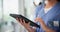 Nurse, hands and research for healthcare on tablet, internet and studying report on technology. Person, hospital and