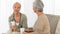 Nurse having a cup of tea with her patient