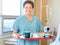 Nurse Holding Breakfast Tray In Hospital Room