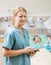 Nurse Holding Digital Tablet With Patient Resting