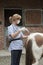 Nurse injecting the backside of a pony