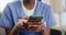 Nurse, internet and smartphone for typing in nursing home, connectivity and browse on social media. Woman, hands and