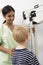 Nurse Measuring Boy\'s Height