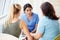 Nurse Meeting With Teenage Girl And Mother