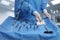 Nurse near table with different surgical instruments in operating room, closeup