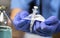 Nurse opens a new syringe in a hospital