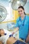 Nurse performing an electrocardiogram test on the patient