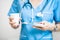 Nurse with pillbox and a cup of water