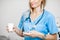 Nurse with pillbox and a cup of water