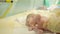 Nurse put just-born baby on a table