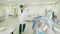 Nurse puts person into tomograph doctor checks connection